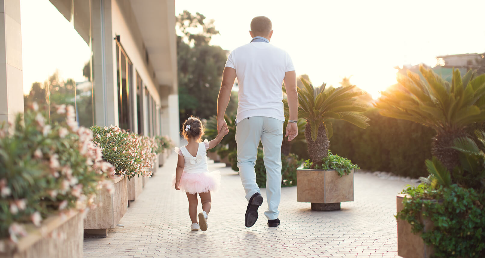 men walking with little girl